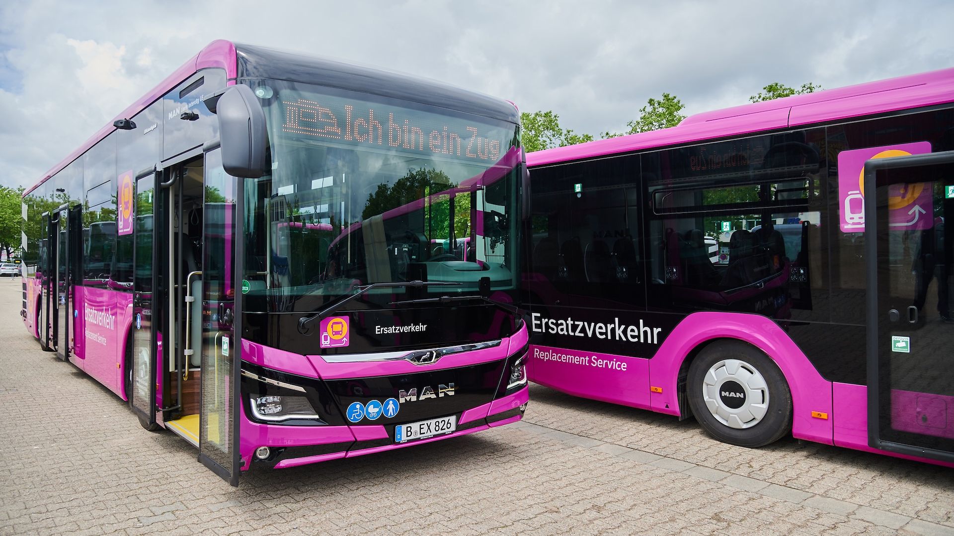 Two replacement buses parked next to each other